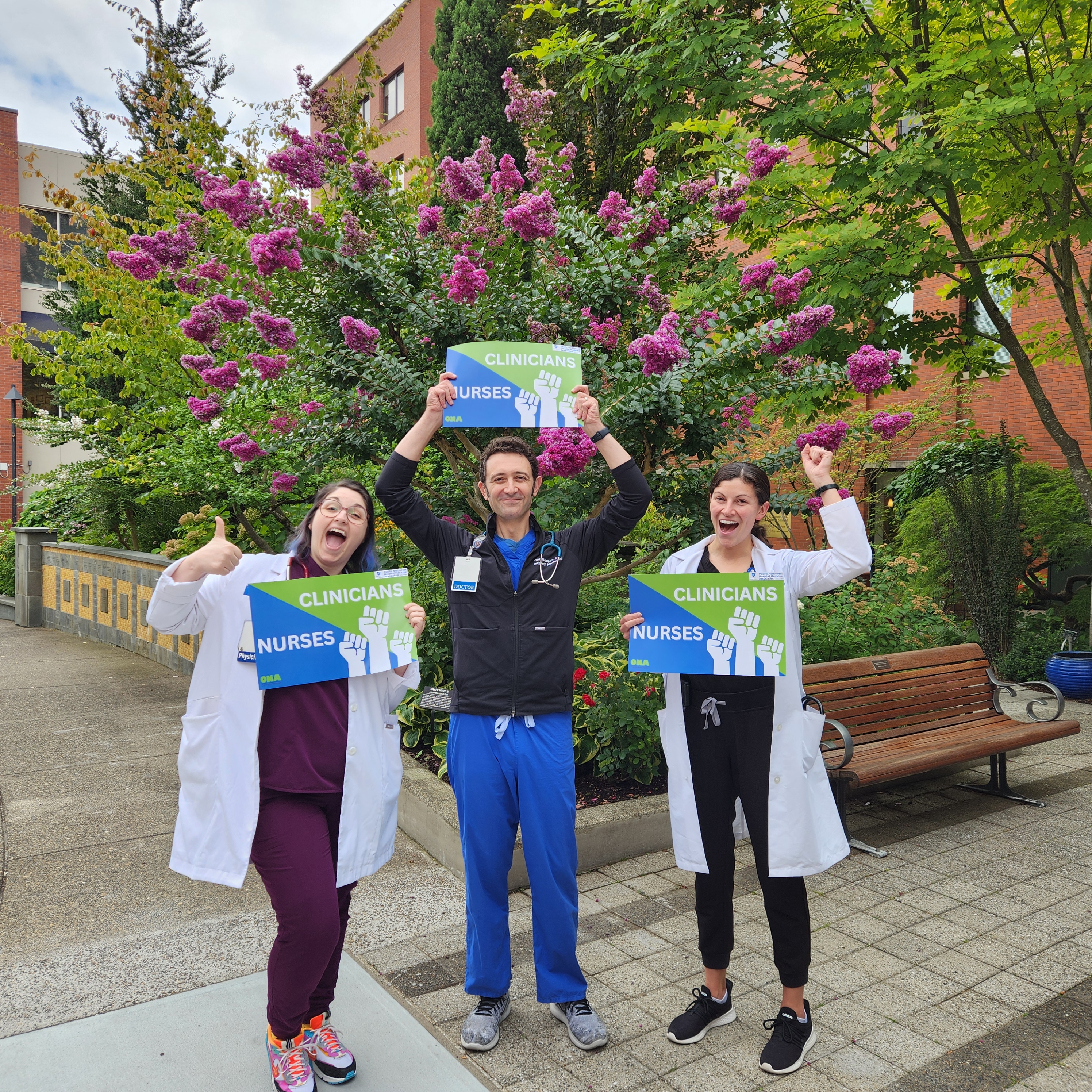 Group of hospitalists with signs