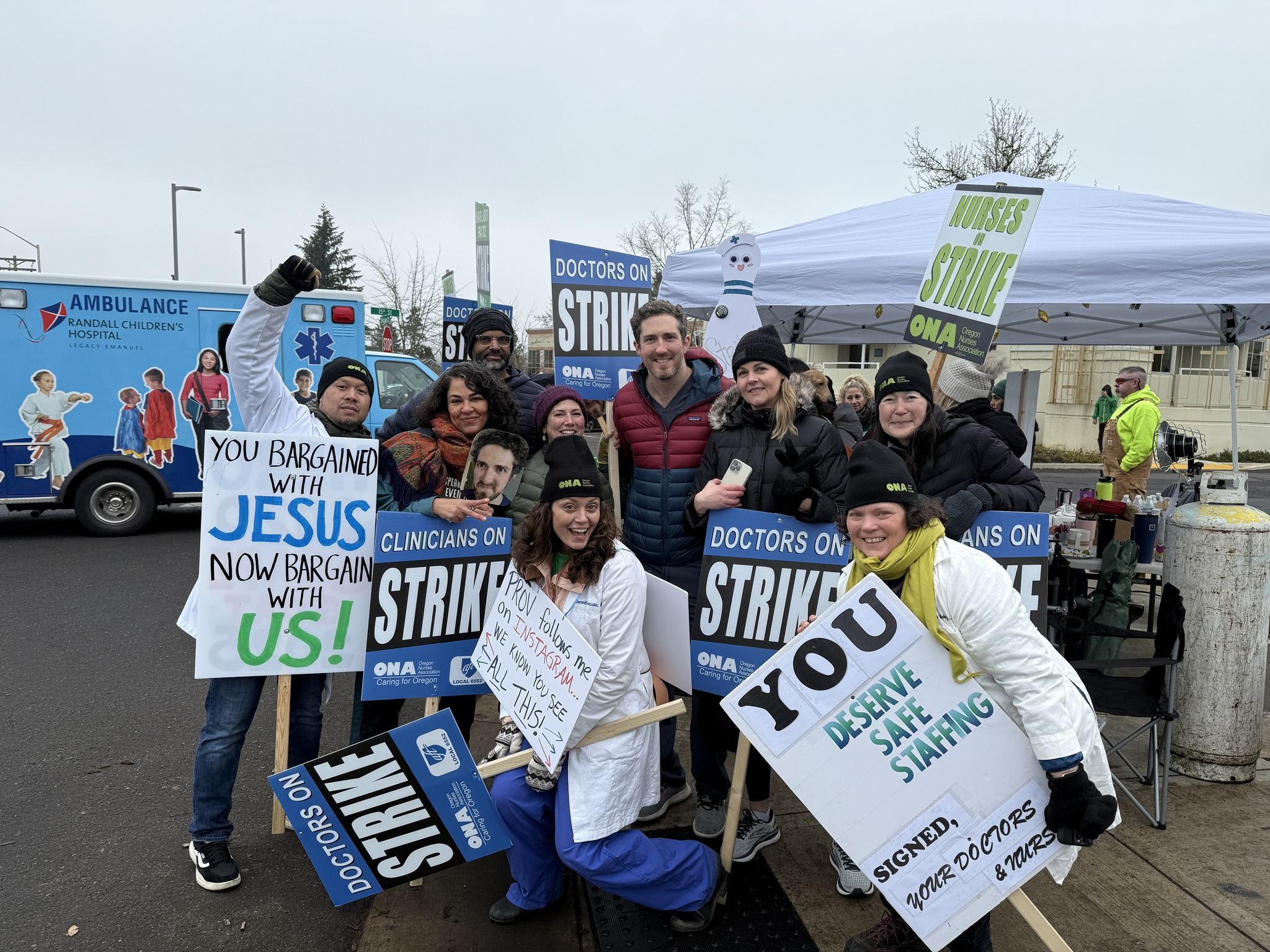 Hospitalists holding strike signs