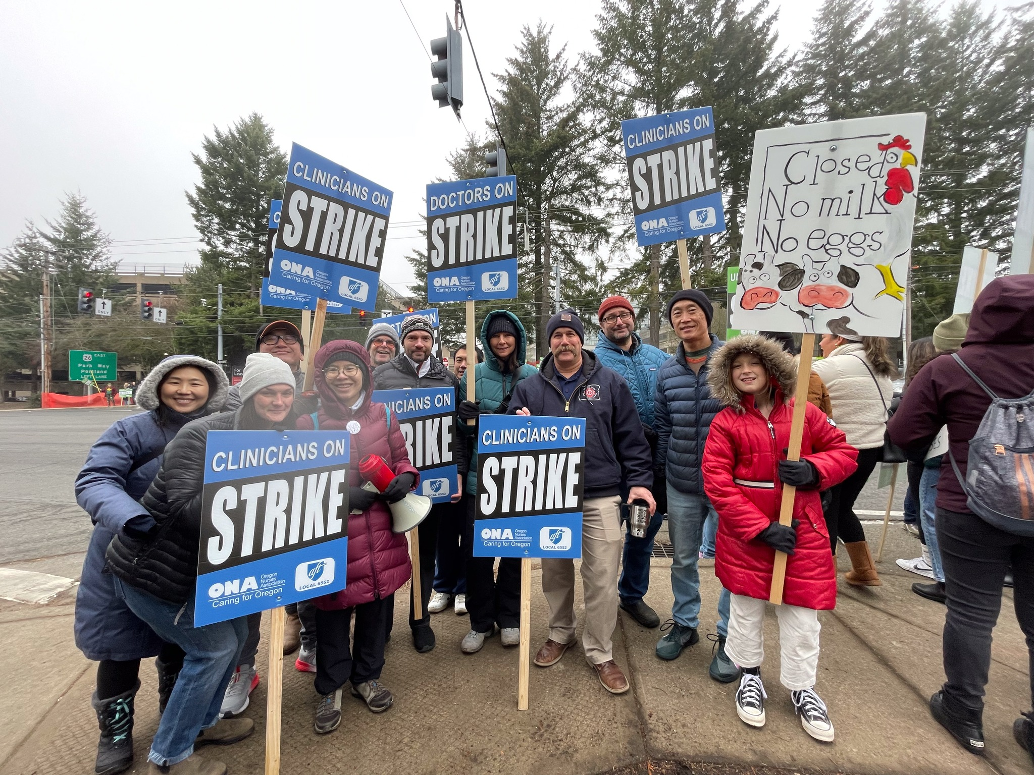 Hospitalists holding strike signs