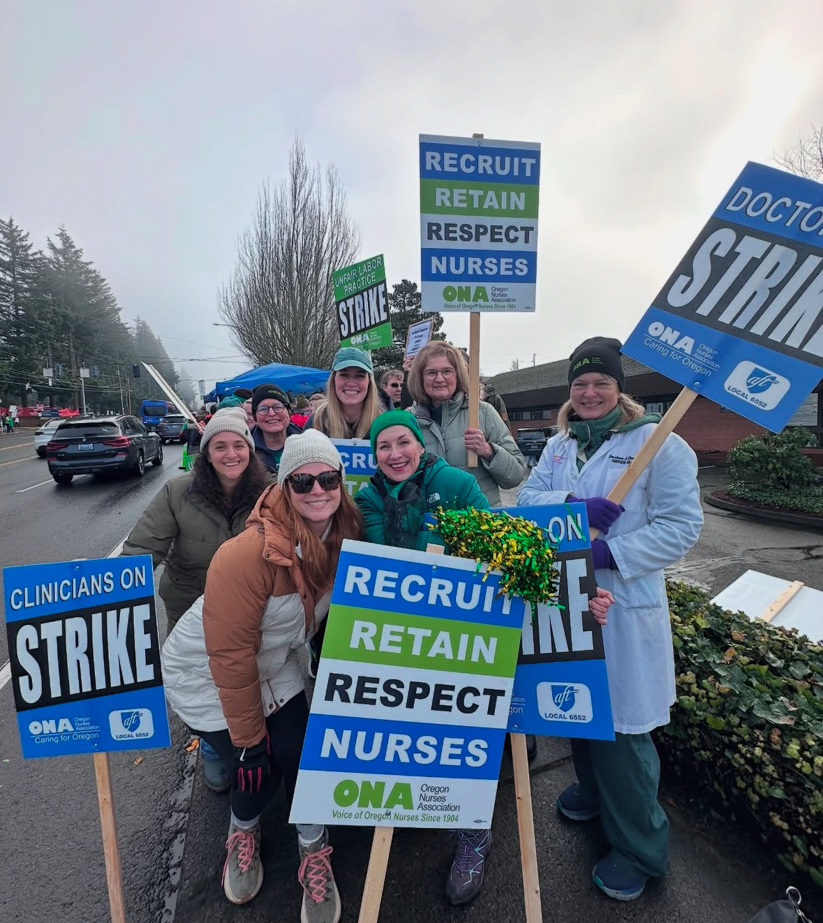 Hospitalists holding strike signs